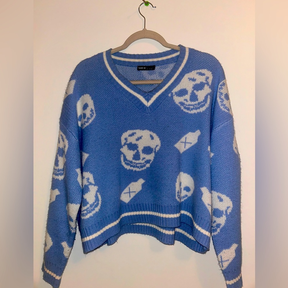Blue sweater.